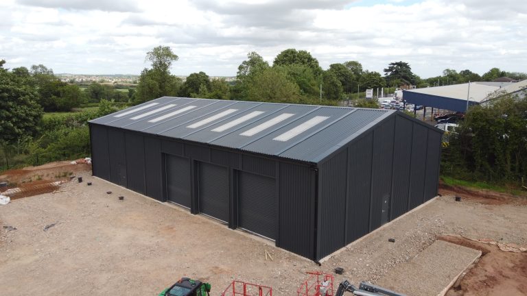 Dark grey relocatable steel building for Derbyshire Mountain Rescue, featuring multiple access doors and rooflights.