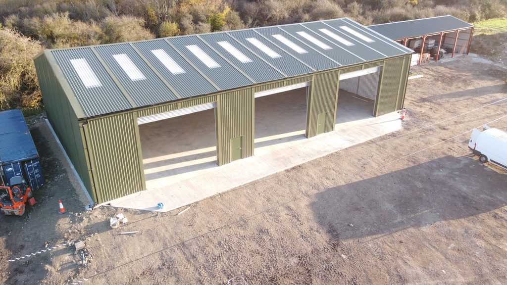 Large Steel Storage building for Utranazz in Oxfordshire with three large roller shutter doors.